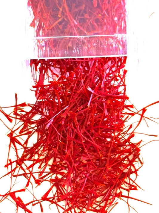 Pure deep red Afghan saffron threads on surface 