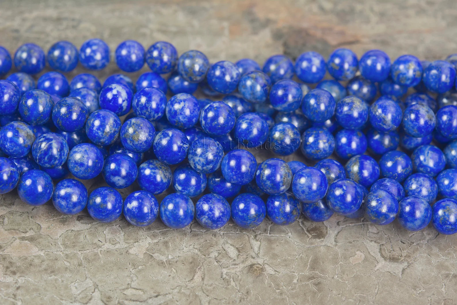 Polished natural Afghan Lapis Lazuli bead with visible golden pyrite and white calcite, perfect for artisan jewellery or healing stones
