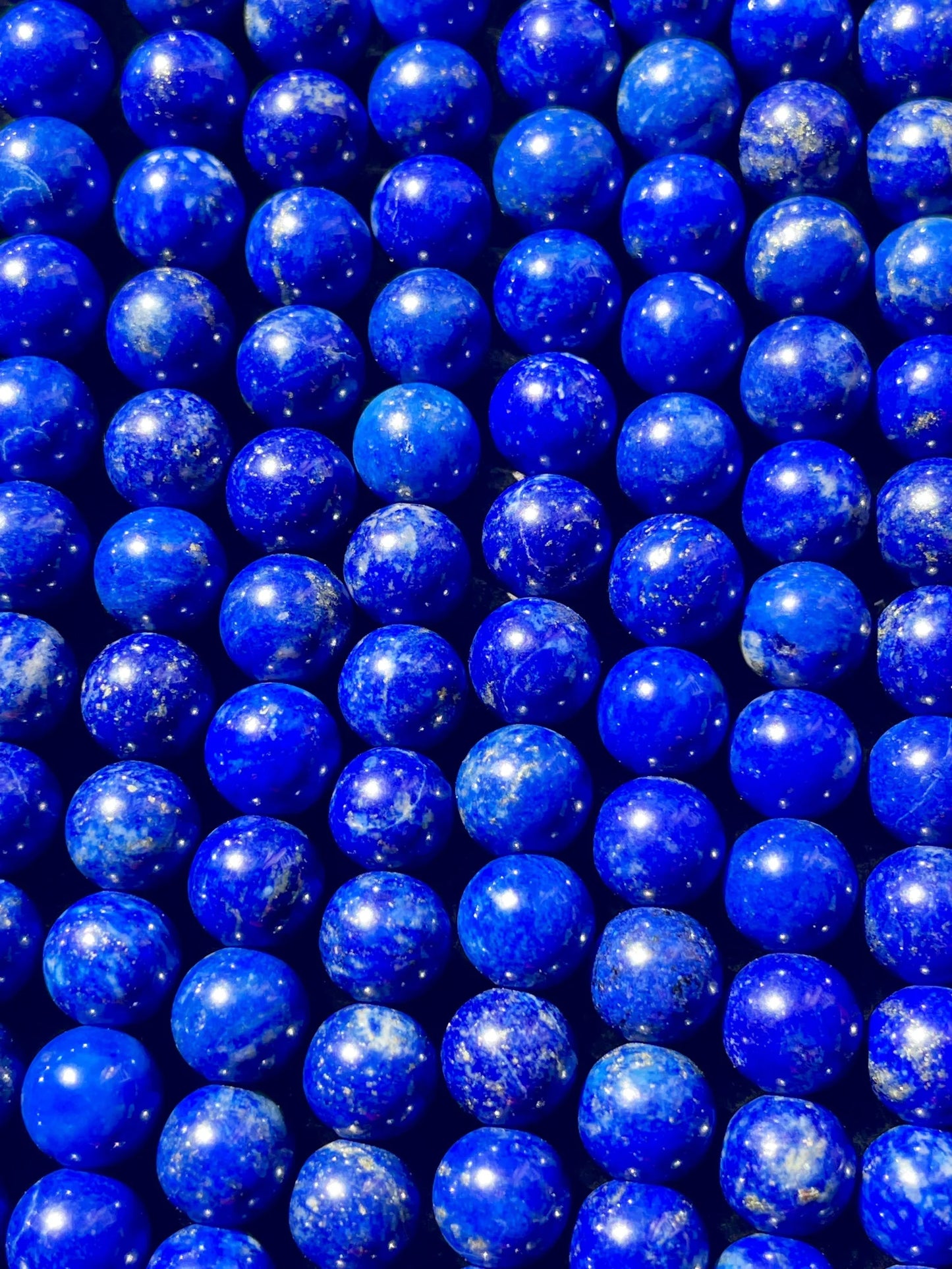 Hand-polished deep blue Afghan Lapis Lazuli bead with golden pyrite for high-end jewellery crafting